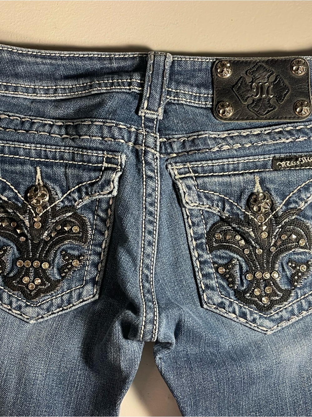 Miss Me Women's Medium Blue Bootcut Jeans with Embellished Fleur-de-Lis Pockets
